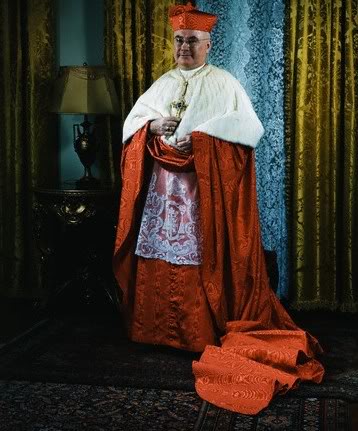 Pope john paul ii in a red robe.