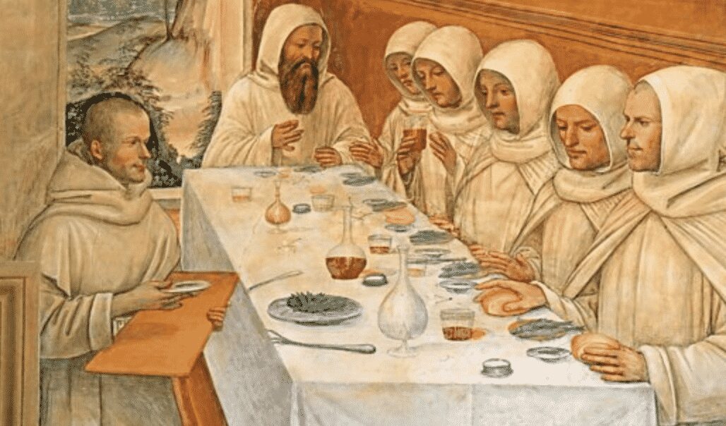 A painting of a group of monks eating at a table.
